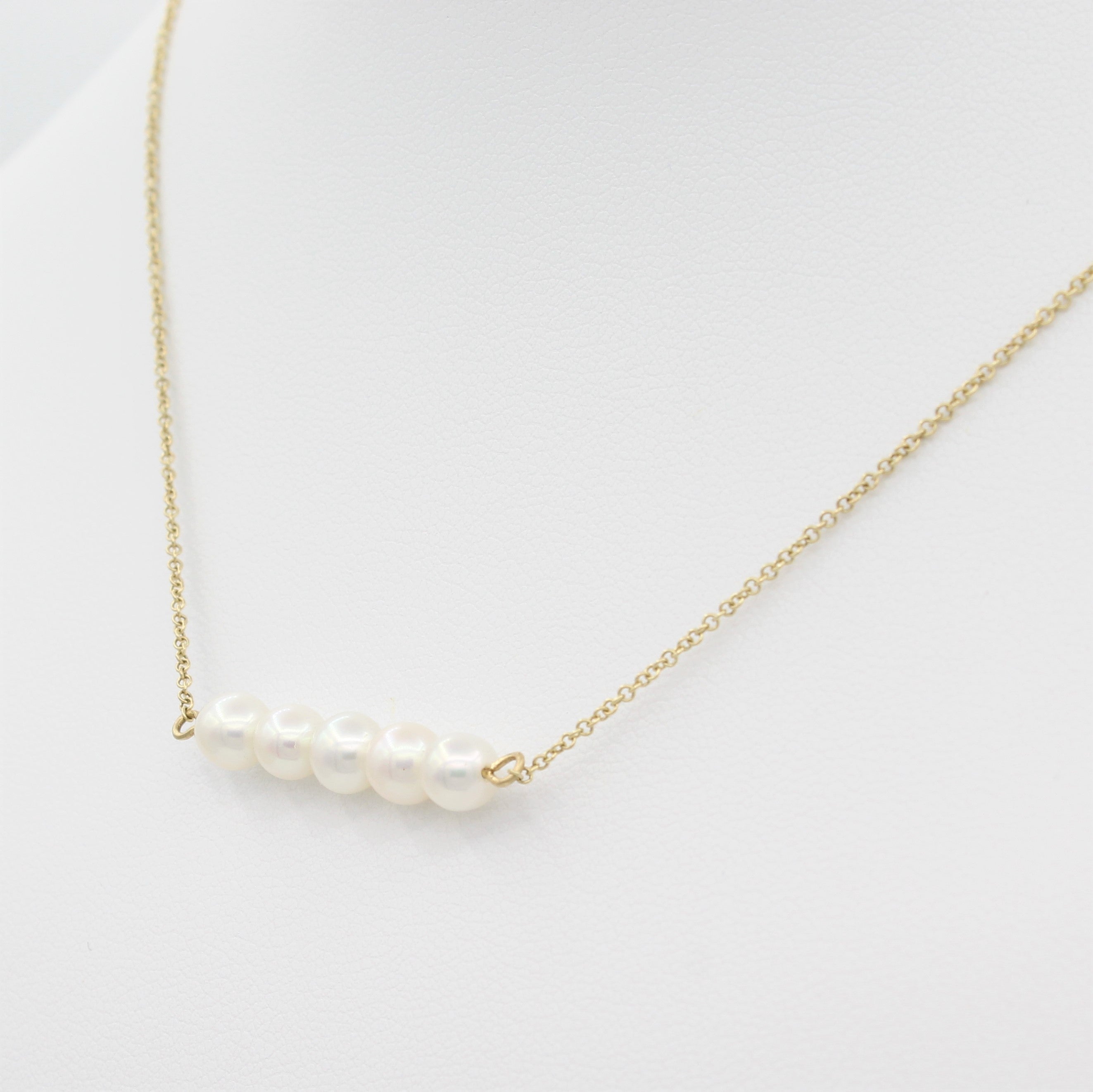 14k Yellow Gold Cultured Freshwater Pearl Bar Pendant, right angle view of pearl bar displayed on a mannequin.