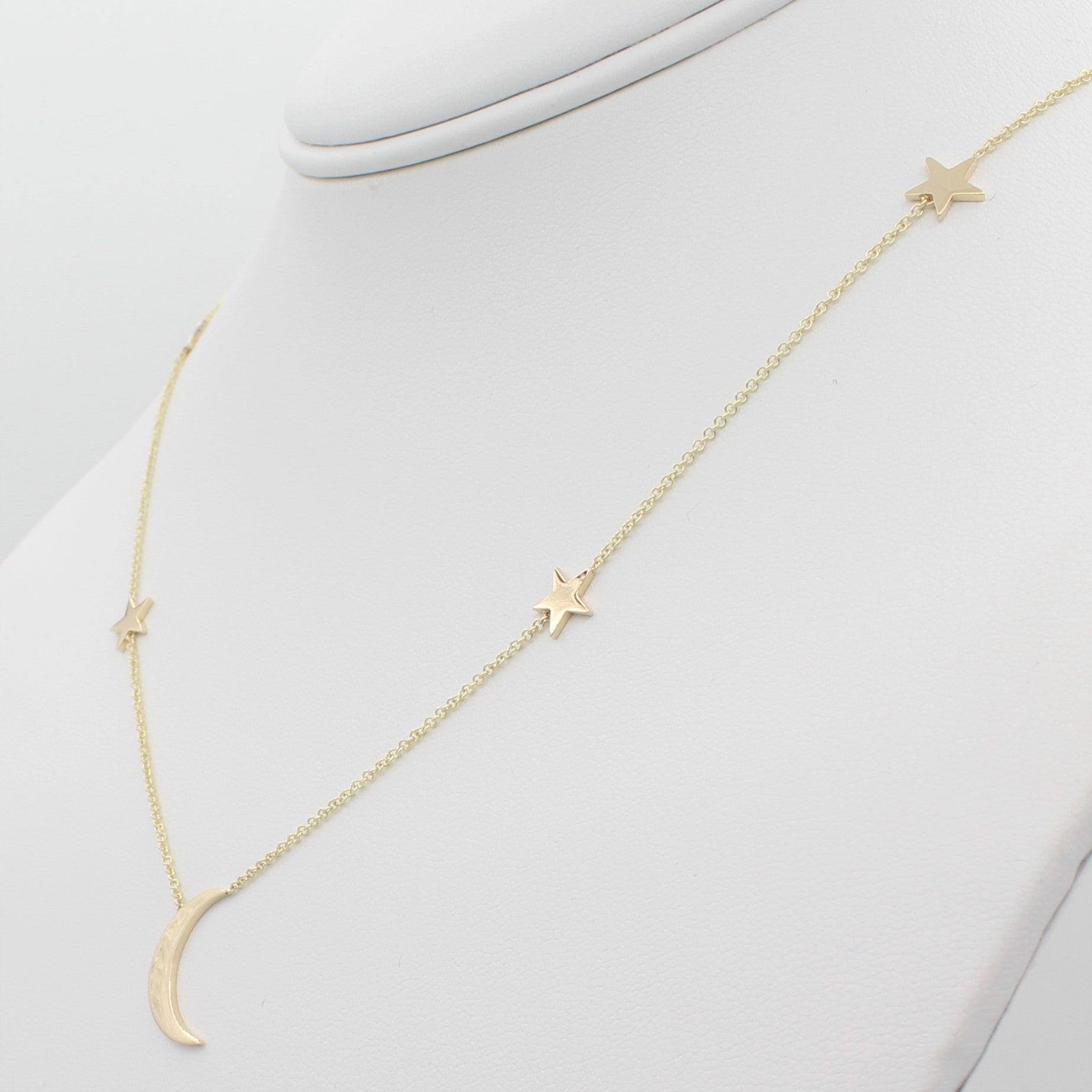 14k Yellow Gold Shoot for the Moon Station Necklace, right angle view of necklace displayed on mannequin neckline. 