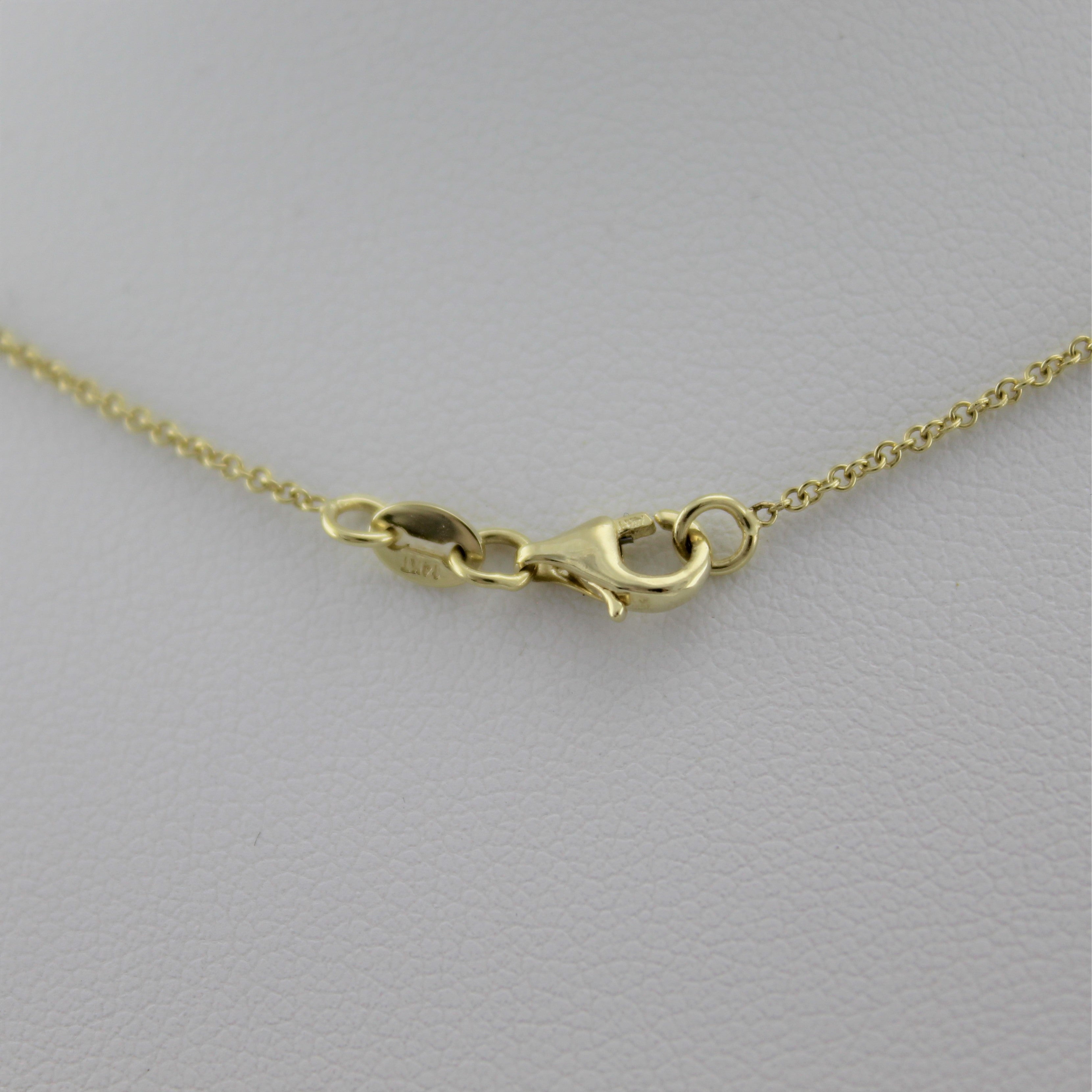 14k Yellow Gold Shining Star Pendant, a peak at the necklace's lobster clasp closure. 