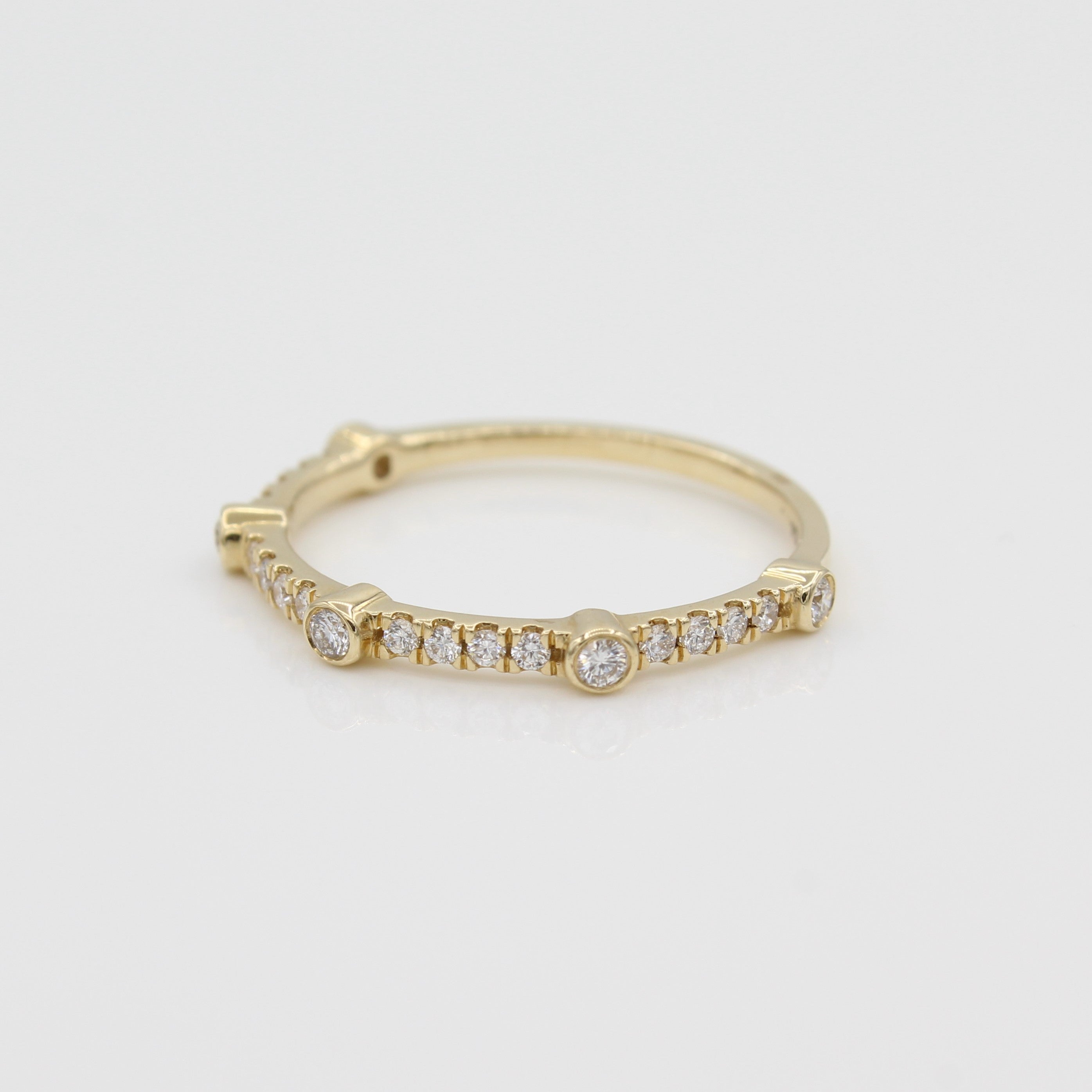 14k Yellow Gold Bezel-Set Diamond 5 Station Ring with Micro-Pave Band, side view from right.