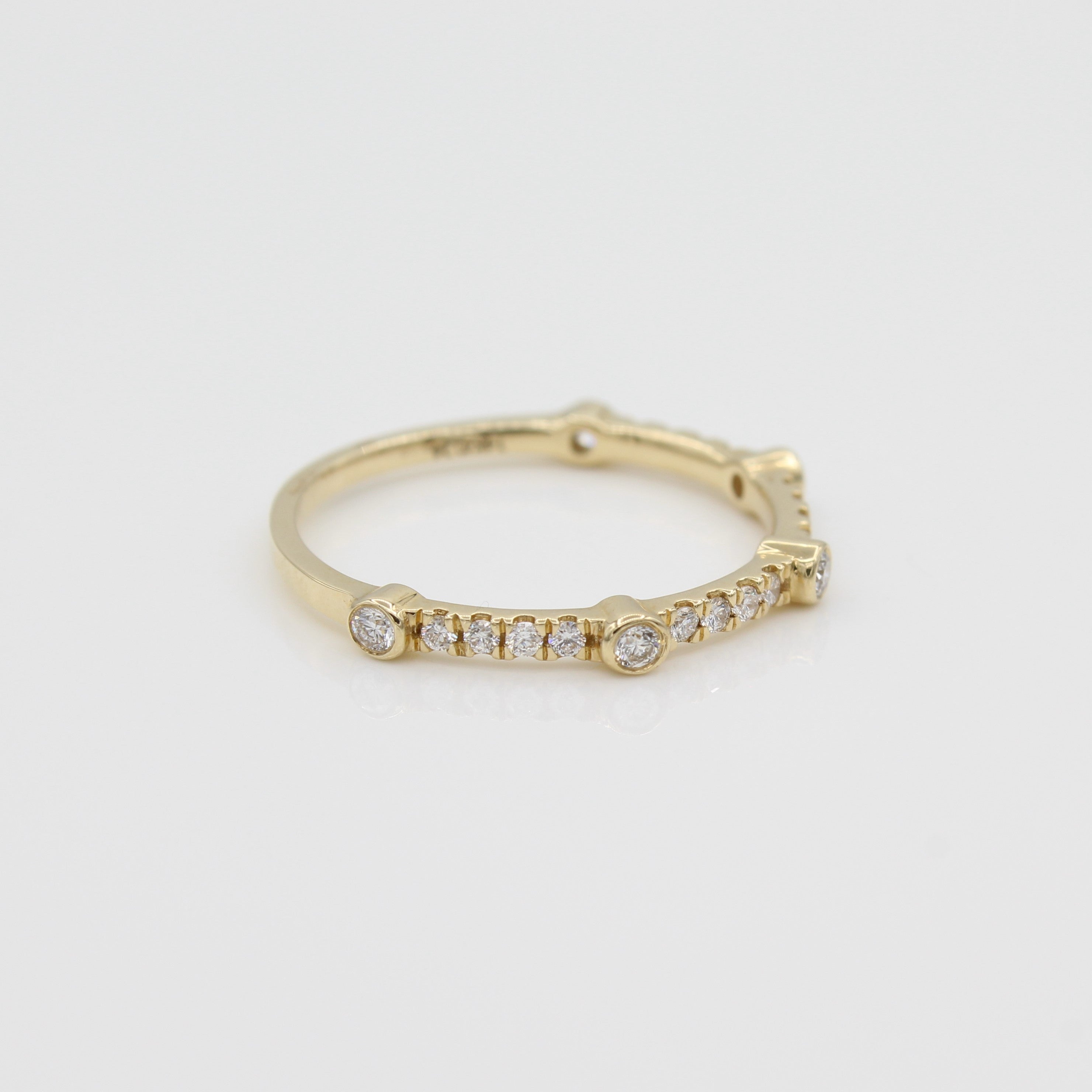 14k Yellow Gold Bezel-Set Diamond 5 Station Ring with Micro-Pave Band, side view from left.