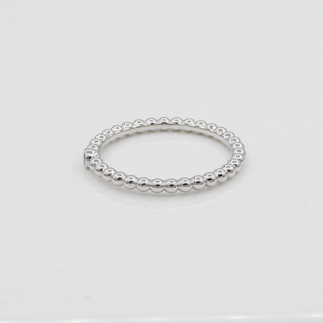 14k White Gold Single Bezel-Set Diamond Beaded Ring, side view from right.