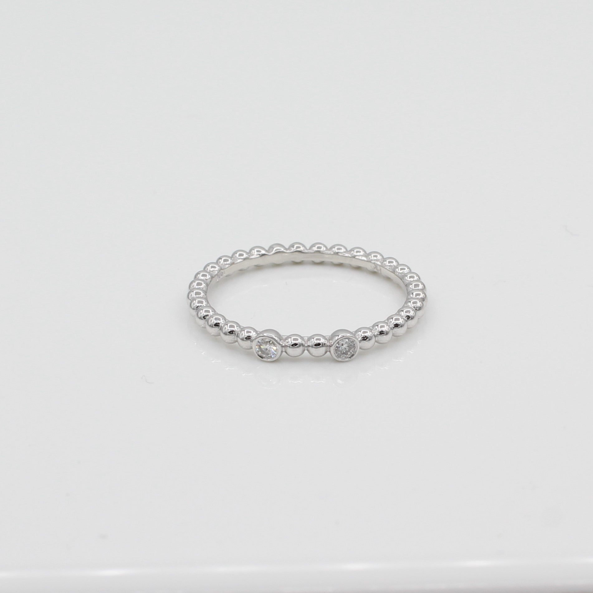 14k White Gold Double Bezel-Set Diamond Beaded Ring, front view highlighting both bezel-set diamonds. 
