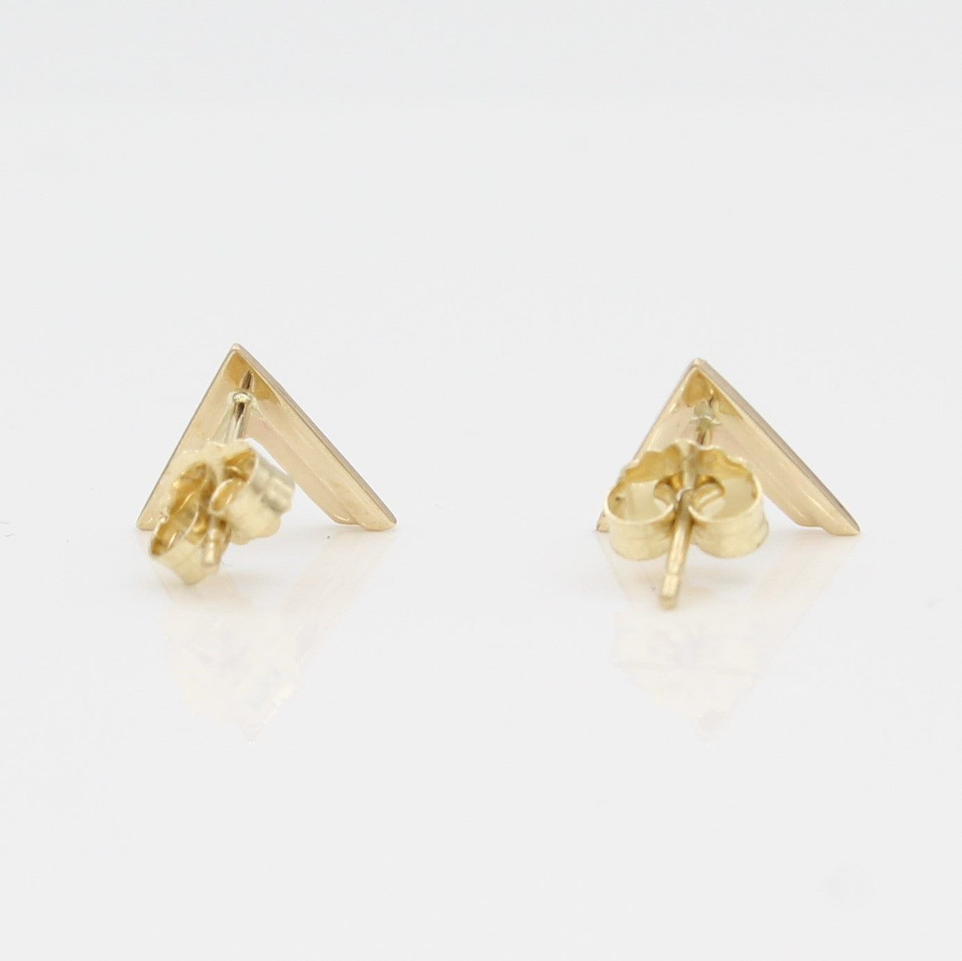 14k Yellow Gold Double Chevron Earrings, back view with a peak at the earring's posts and backs.