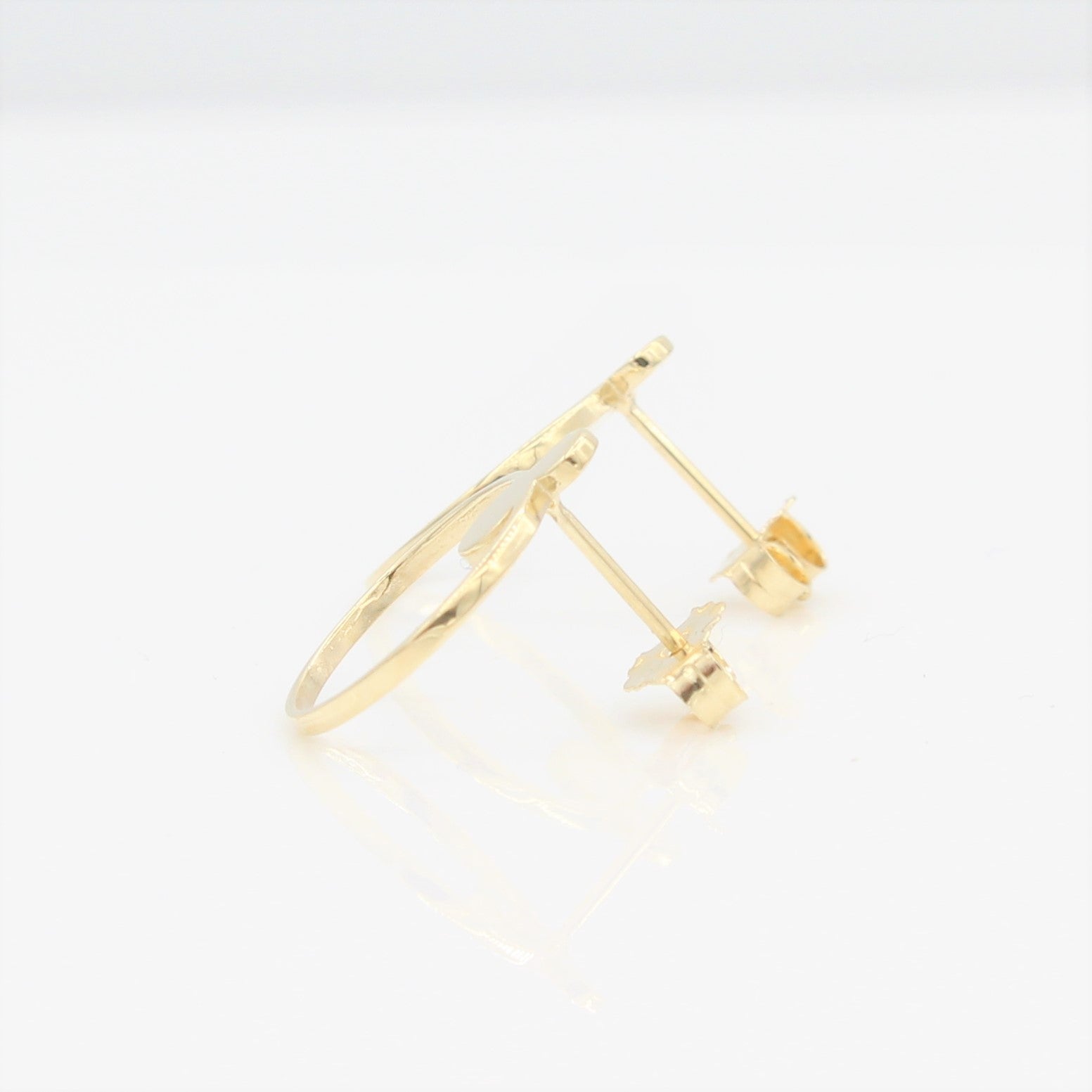 14k Yellow Gold Open Circle Front Facing Hoop Stud Earrings, side view with a peak of the earring posts and backs