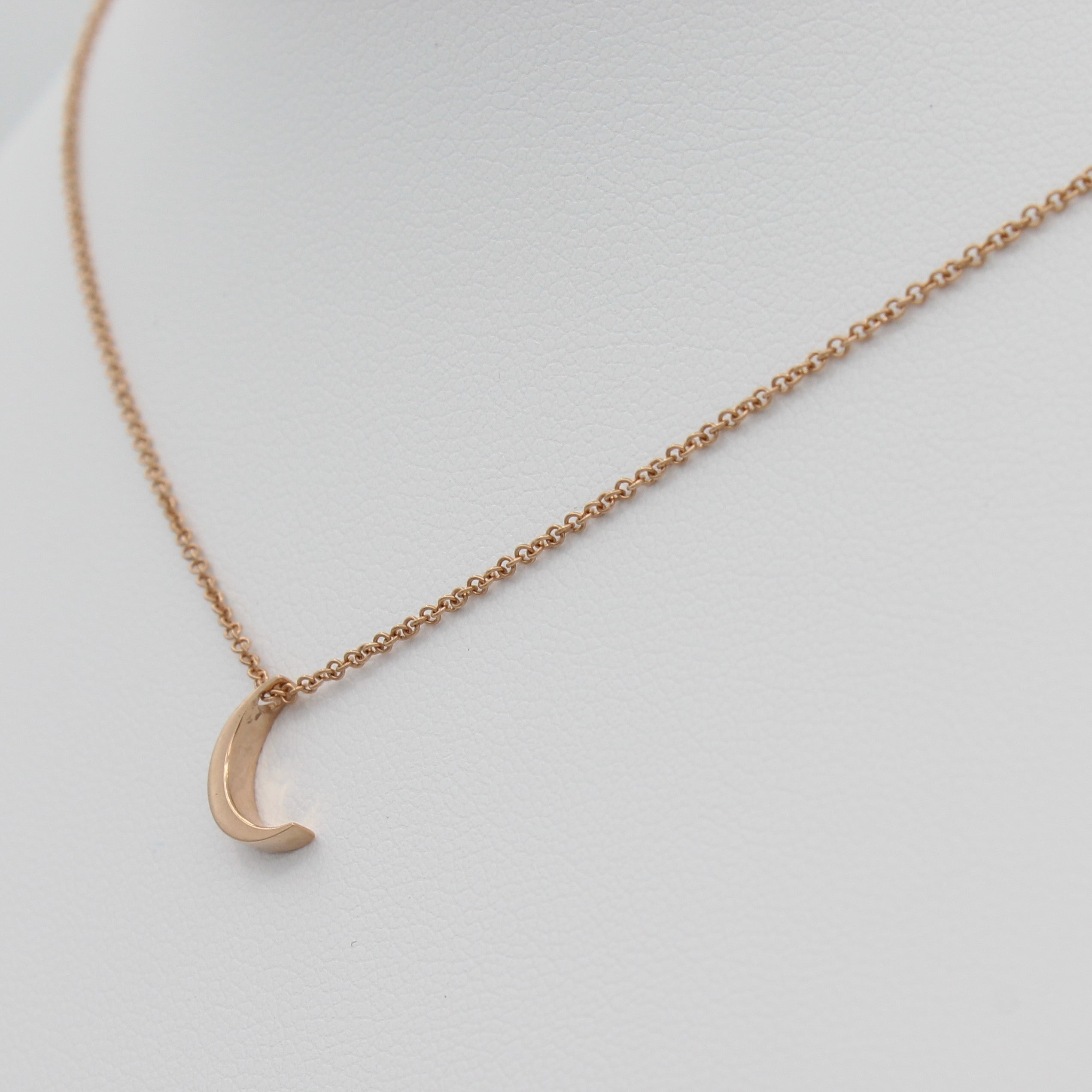 14k Yellow Gold Crescent Moon Pendant, right angle view of necklace displayed on a mannequin.