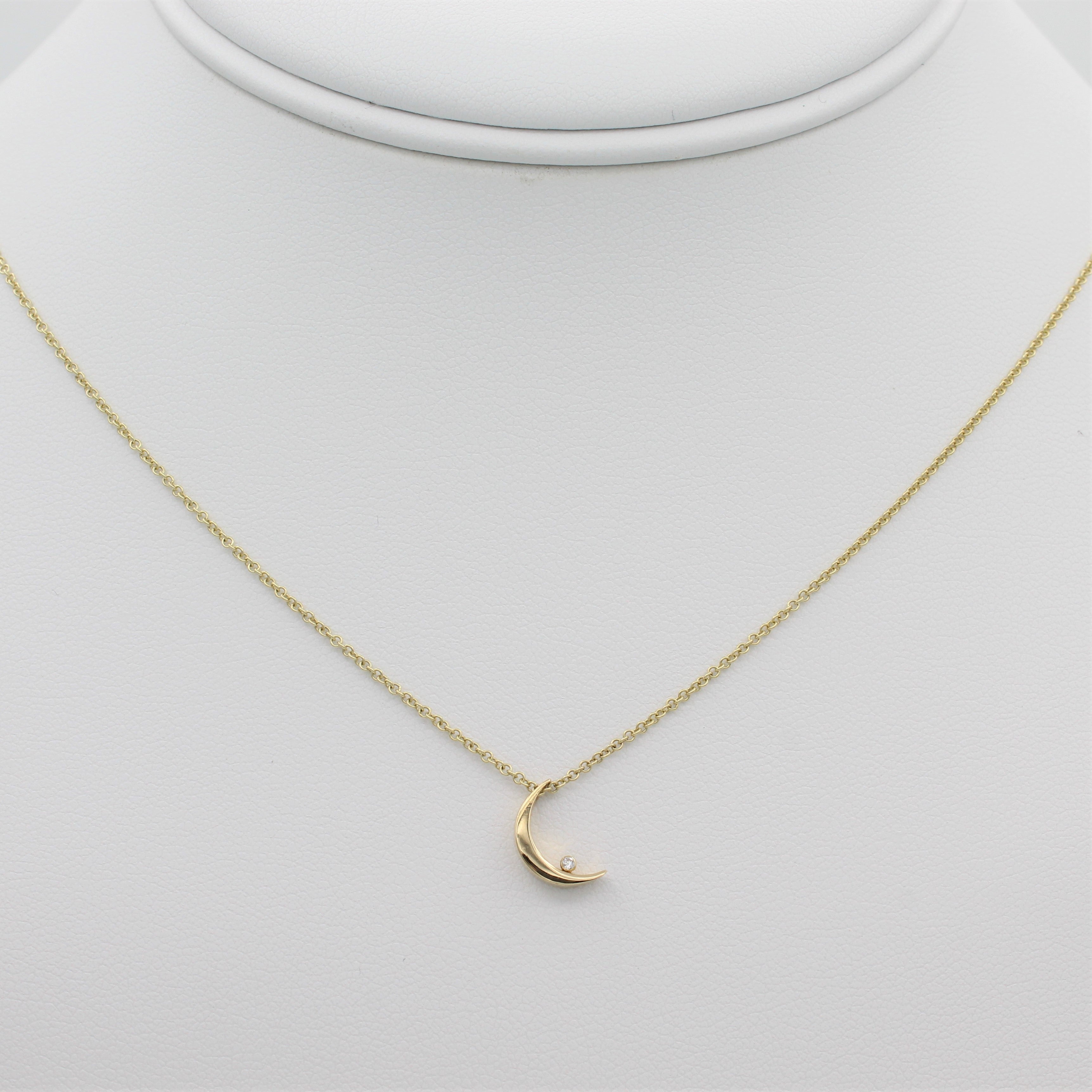 14k Yellow Gold Crescent Moon with Diamond Pendant, front view of necklace displayed on mannequin. 