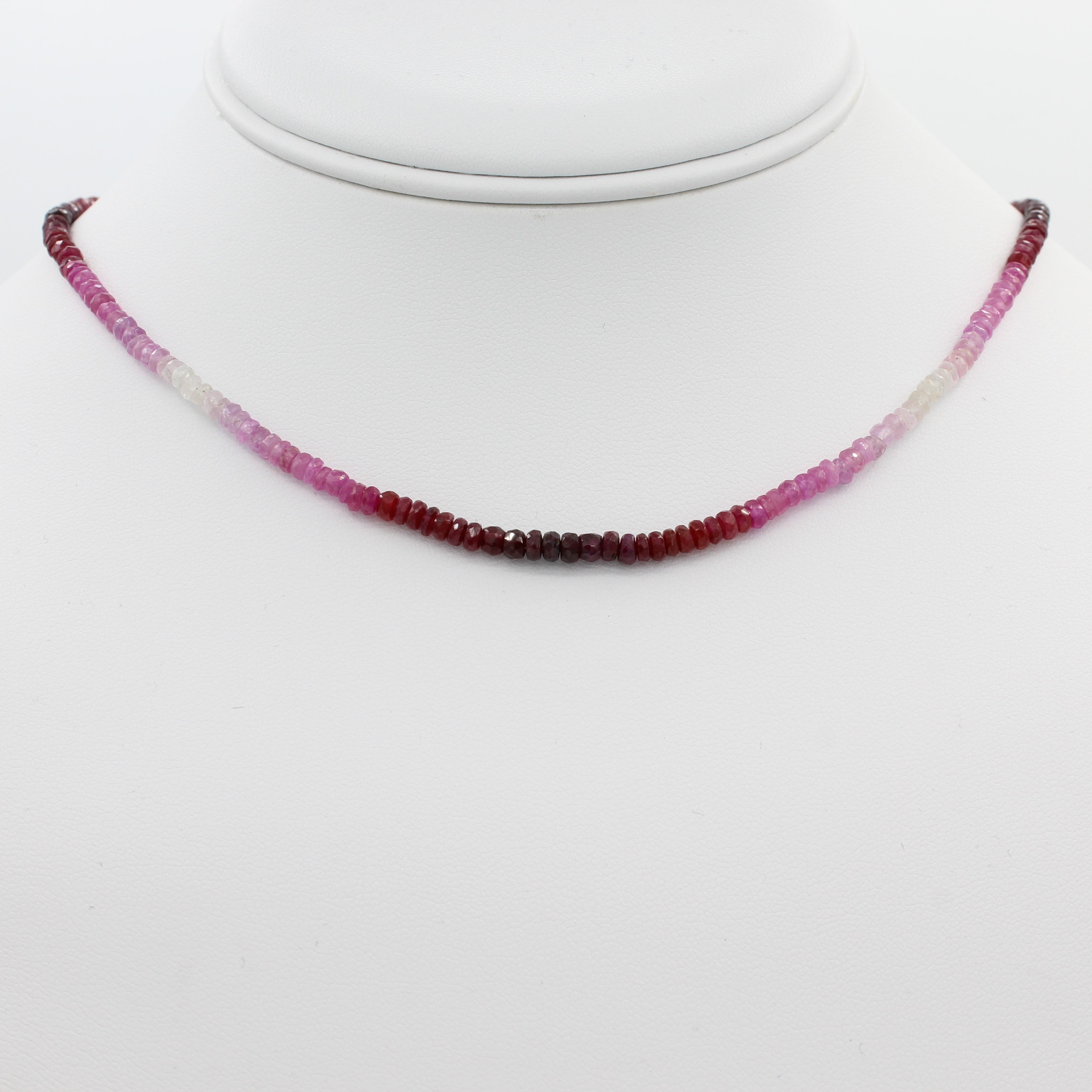 Radiant in Red 40CT Adjustable Ombre Ruby Choker Necklace, a front view of the necklace displayed on a mannequin neckline.