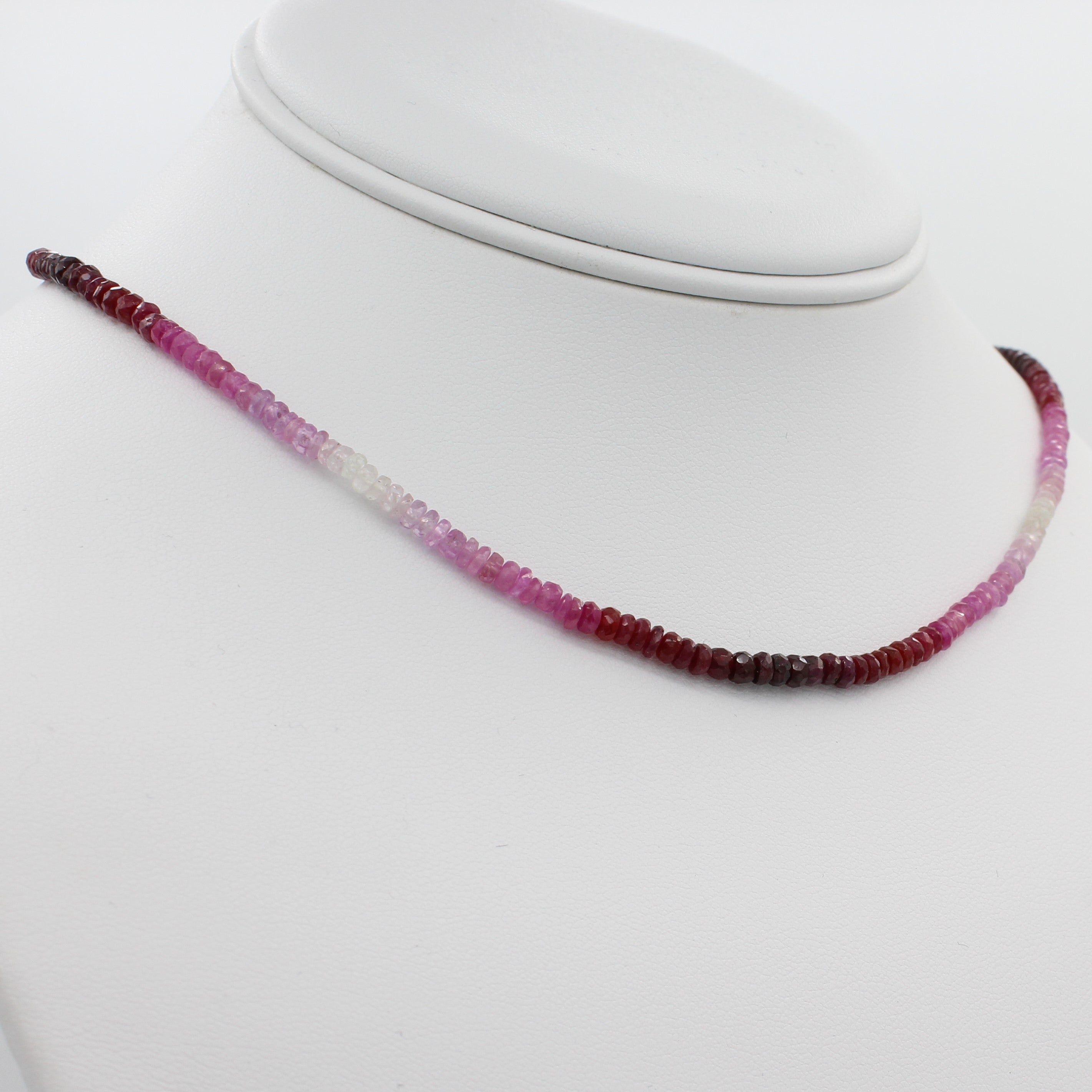 Radiant in Red 40CT Adjustable Ombre Ruby Choker Necklace, a left angle view of the necklace displayed on a mannequin neckline. 
