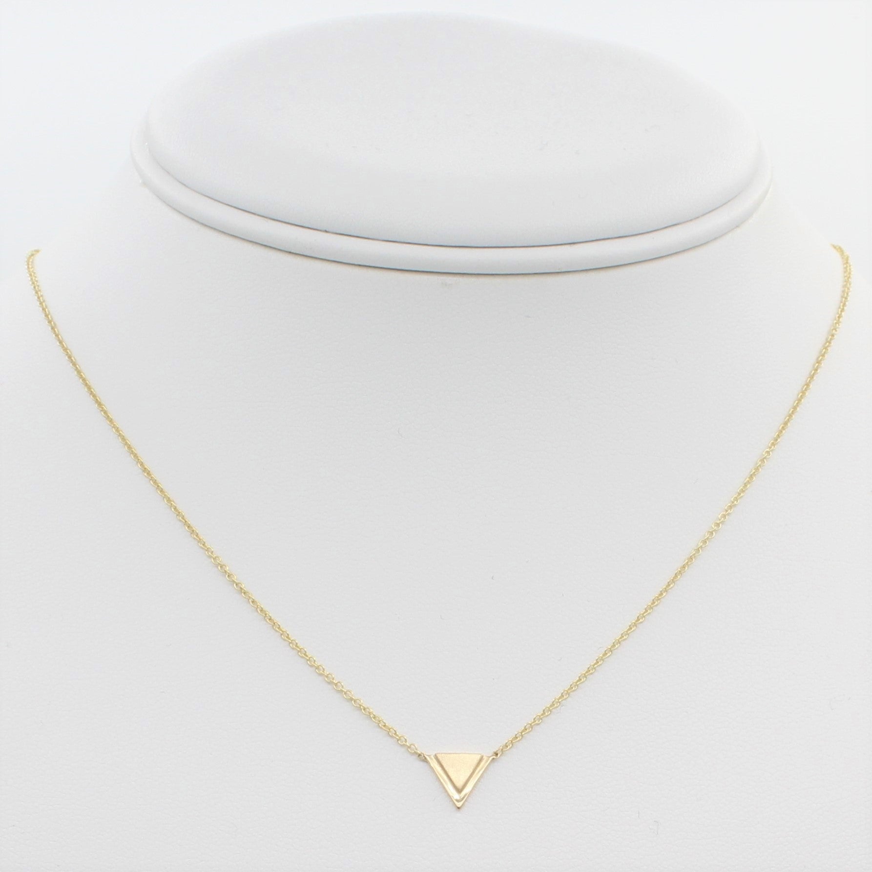 14k Yellow Gold Petite Double Triangle Single Station Pendant, front view of necklace displayed on a mannequin neckline. 