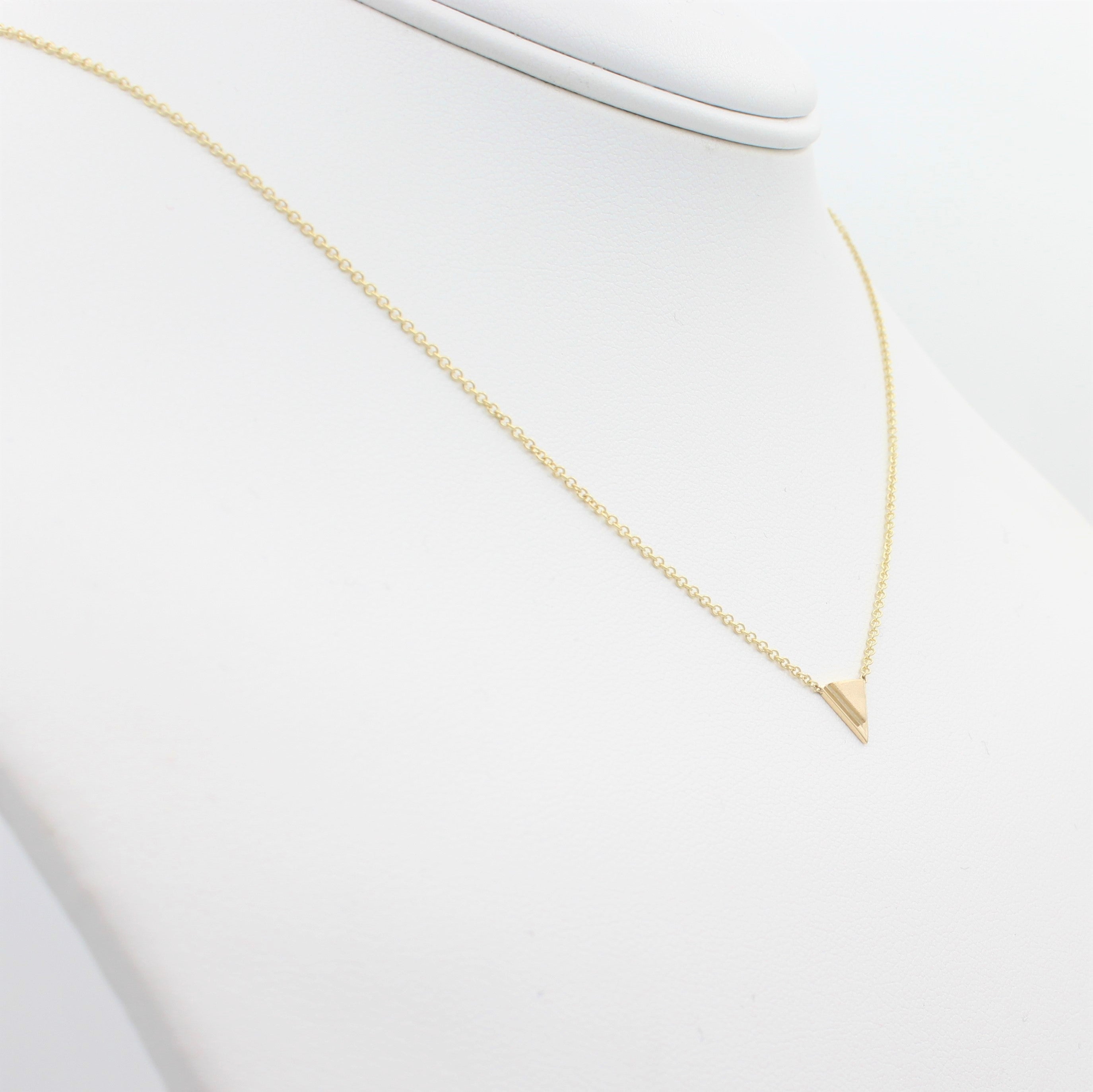14k Yellow Gold Petite Double Triangle Single Station Pendant, left angle view of necklace displayed on a mannequin neckline. 
