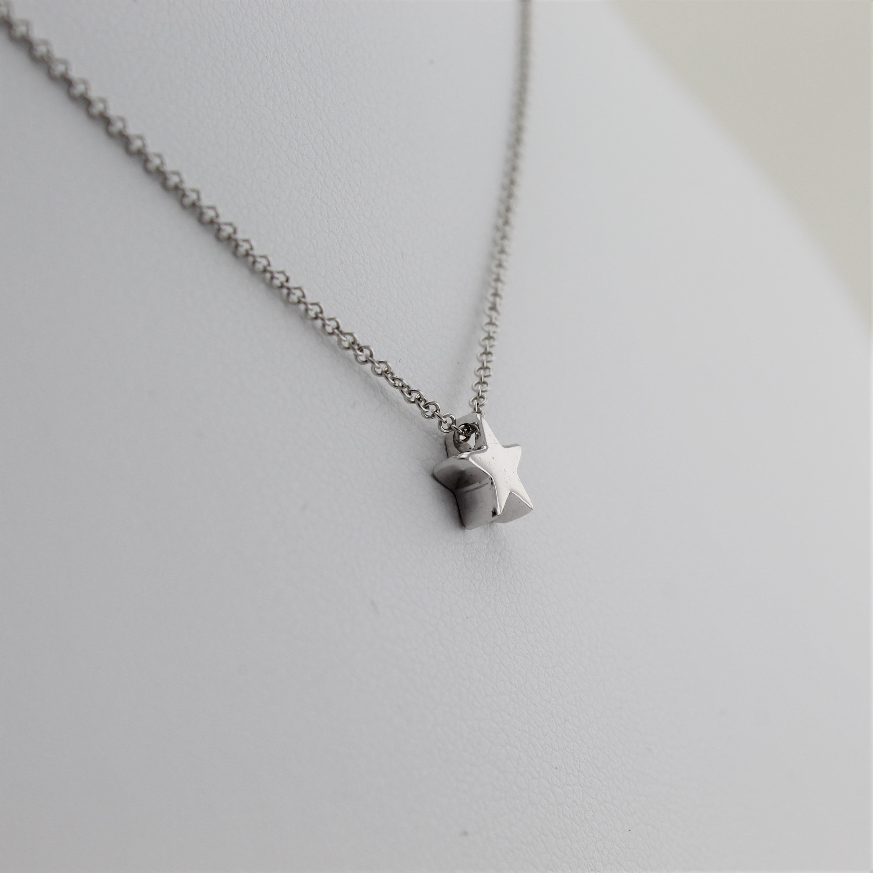 14k White Gold Shining Star Pendant, close-up left angle view of necklace highlighting the dainty star pendant.