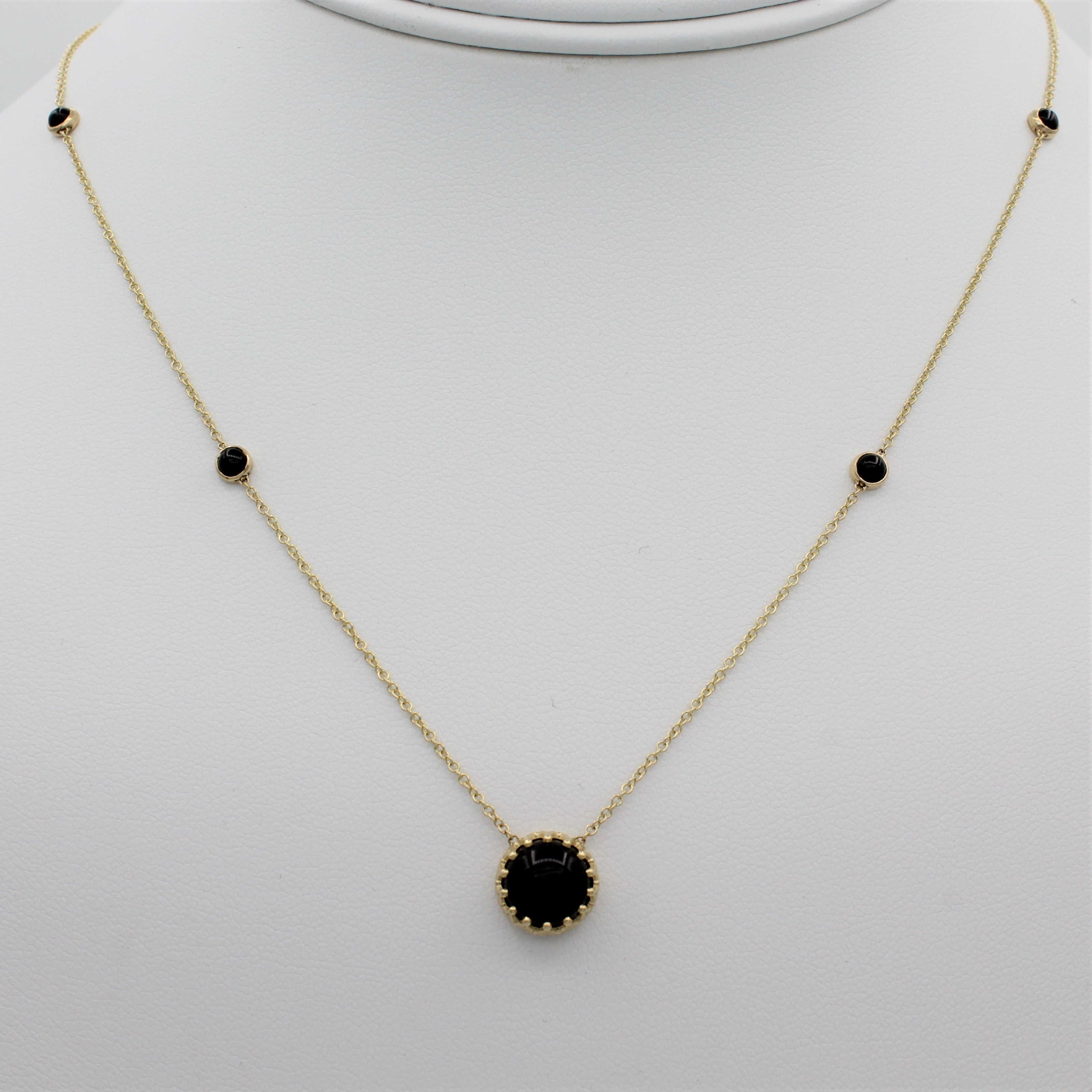 14k Yellow Gold Bewitched Black Onyx Station Necklace, front view of necklace displayed on a mannequin. 